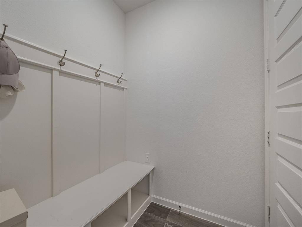 opposite of the laundry room is your mudd area and entrance to the garage