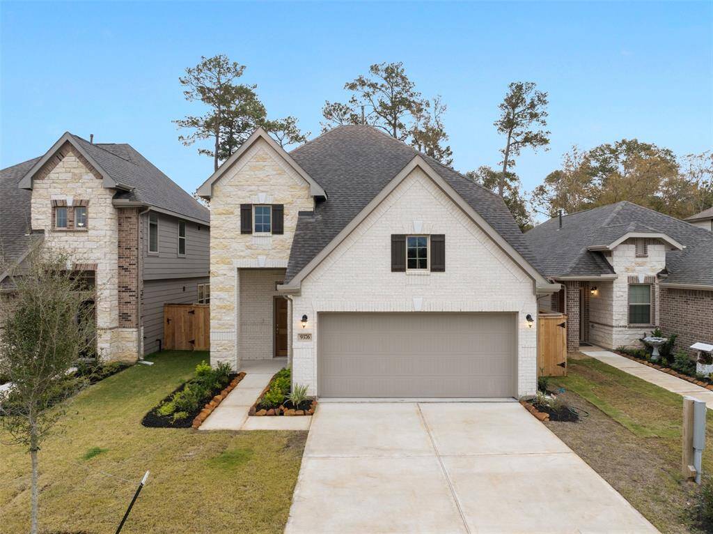 Curb appeal, 2 car garage with double wide driveway