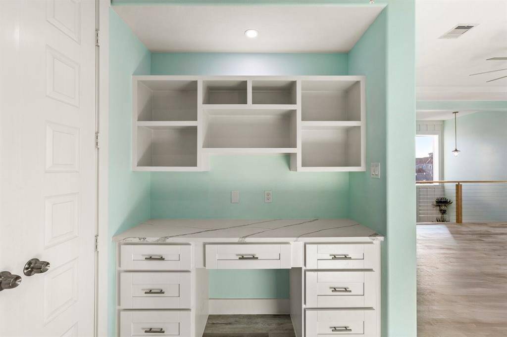 There are several custom-built desk areas.