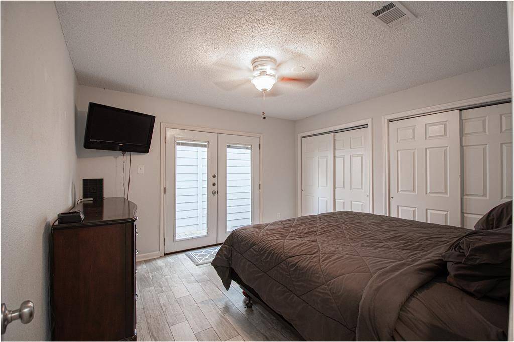 bedroom that leads to outdoor space and garage