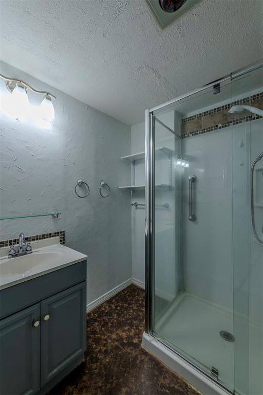 Primary bathroom features a walk-in shower and heated floor.