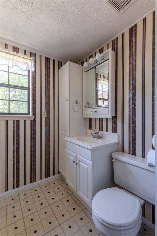 Bathroom 2 features a shower/tub combo.