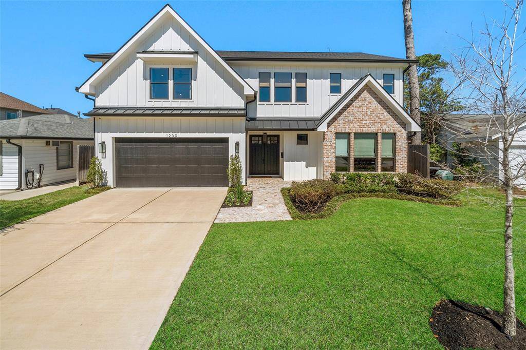 Gorgeous exterior with gas lantern entry and well manicured landscaping.