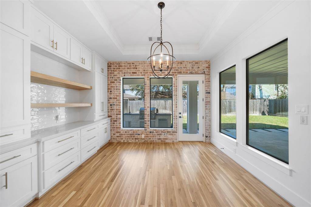 Large dining room off of the kithcen with custom butler's pantry.