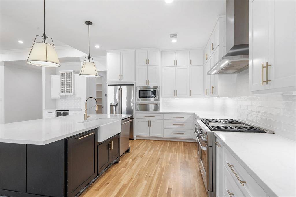 Kitchen with high-end appliances and fixtures.