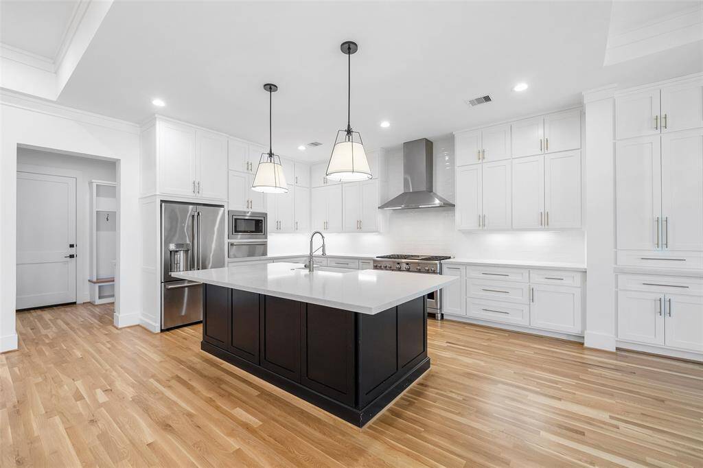 Kitchen which leads to the walk-in pantry, mud area, and laundry room.