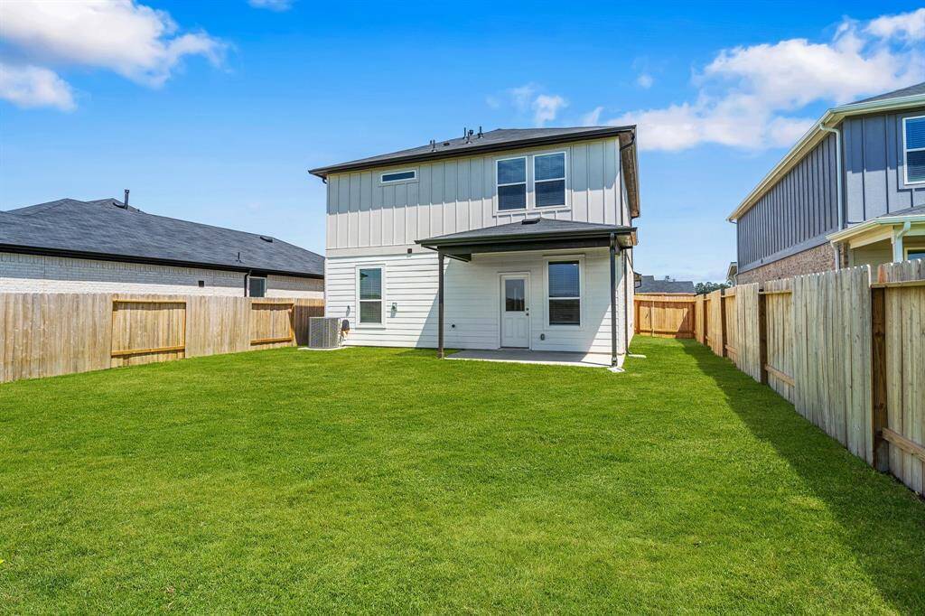 enormous backyard with covered patio