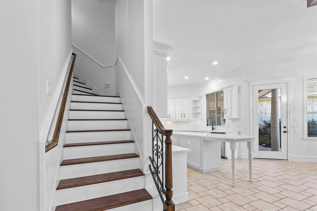Conveniently located 2nd or back staircase leading up into the bedrooms and down into the family room / kitchen area.