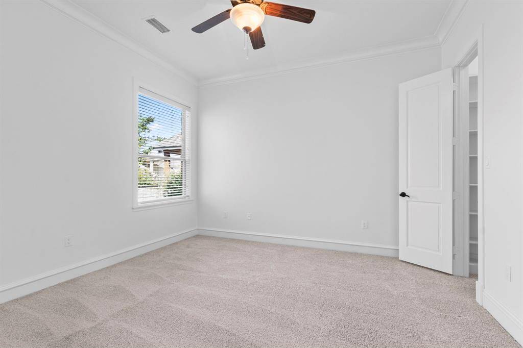 Large Bedroom # 2 DOWNSTAIRS perfect for your guests with an en-suite bathroom and a walk in closet.