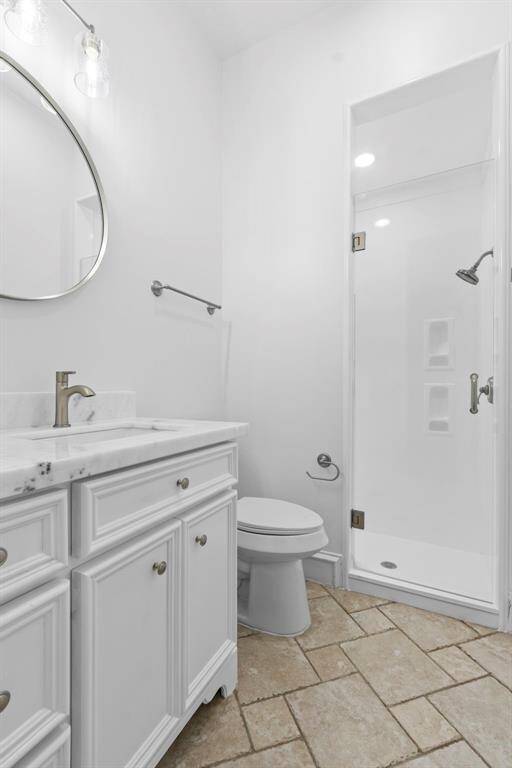 Full Bathroom # 2 downstairs has a completely reglazed shower, Quartz counters, new faucets, lighting, toilet, sink and mirror.