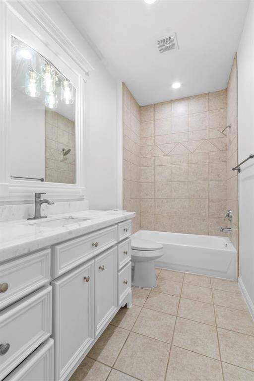 Bathroom # 4  with Quartz counters, framed mirror and reglazed tubs, new toilet, new fauce /sink.