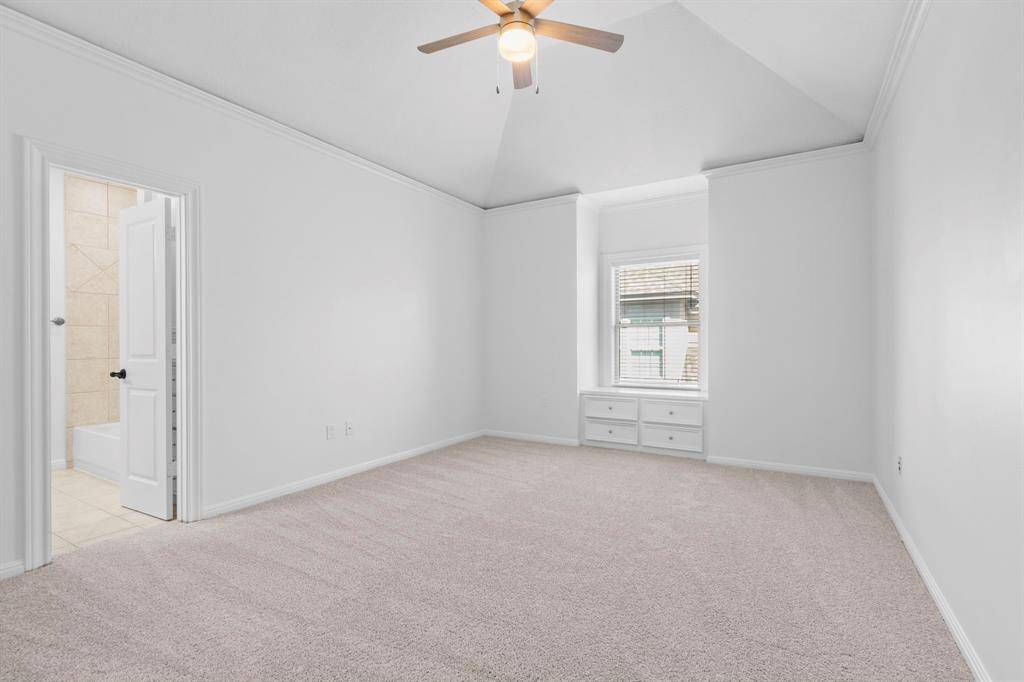 Generously sized Bedroom #5, complete with an ensuite bathroom and a cozy reading nook featuring spacious storage drawers.