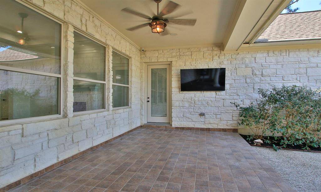 Large Outdoor Patio overlooking the backyard .