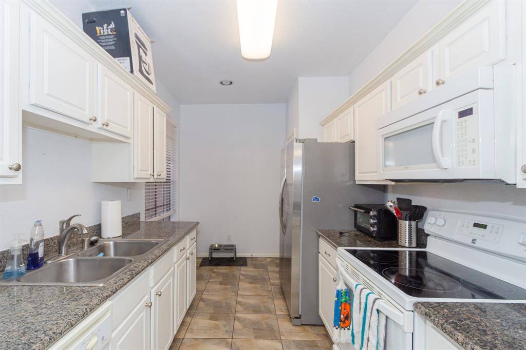 kitchen with new stainless steel fridge
