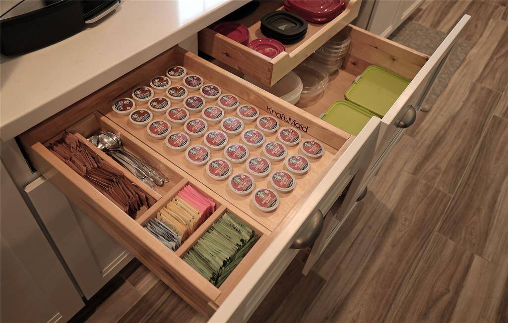 High end Kraft Maid cabinets with custom pull-out drawers for functional storage solutions.