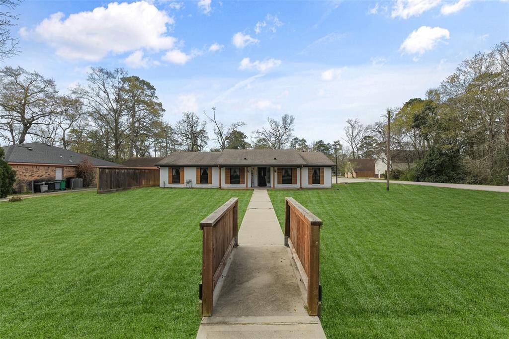 The home is located in Timber Lakes on one of the highest elevation in the neighborhood, and zoned to lowest flood risk zoning, Additionally, this home offers unbeatable convenience- just minutes away from The Woodlands Mall and major highways. Sturdy cedar sidewalk guards are securely anchored to the concrete, ensuring lasting durability.