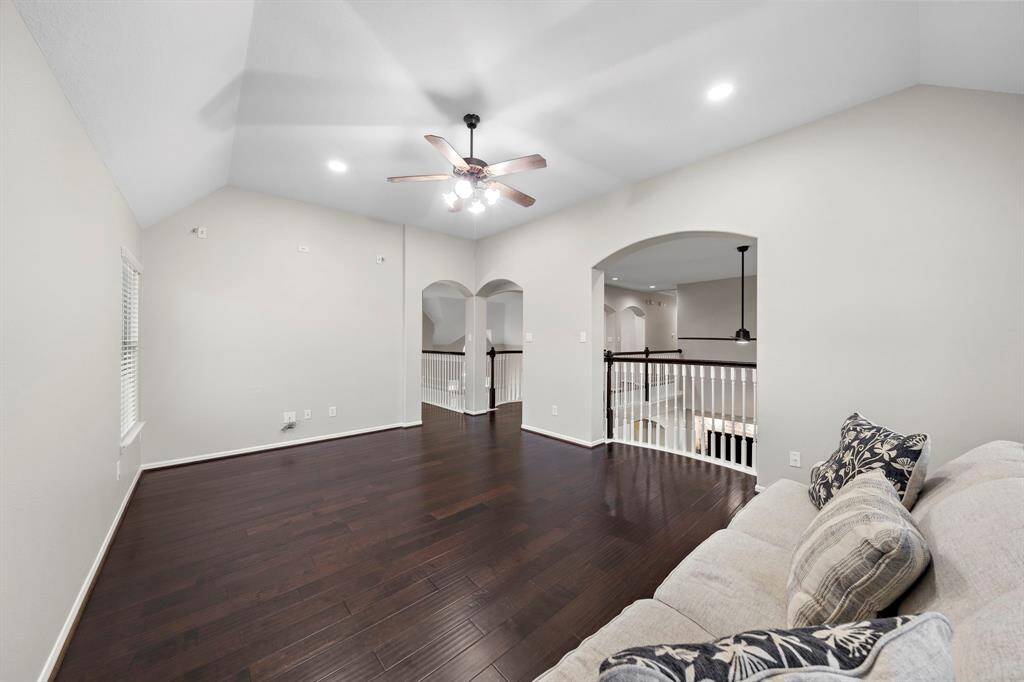 Featuring open sightlines to the main floor, this cozy loft area offers versatility and functionality. It’s an ideal setting for casual seating or a reading nook.
