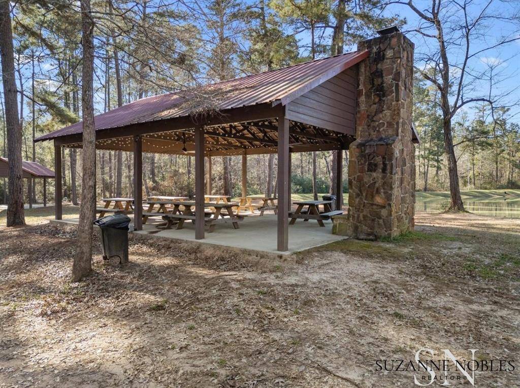 One of the covered pavilions includes a beautiful wood-burning fireplace.