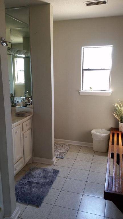 Bathroom and shower with pegs like a locker room