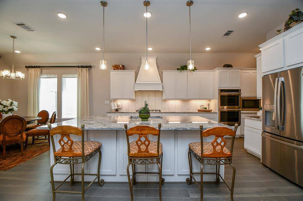 The breakfast bar is not only a great place to sit, it also has cabinets for even more storage.