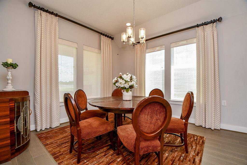 The breakfast nook is surrounded with window for a bright and cheery way to start the day.