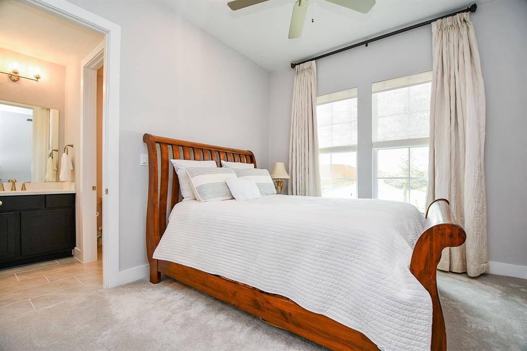 The first of 2 secondary bedrooms is located at the front of the house with a connecting bathroom.