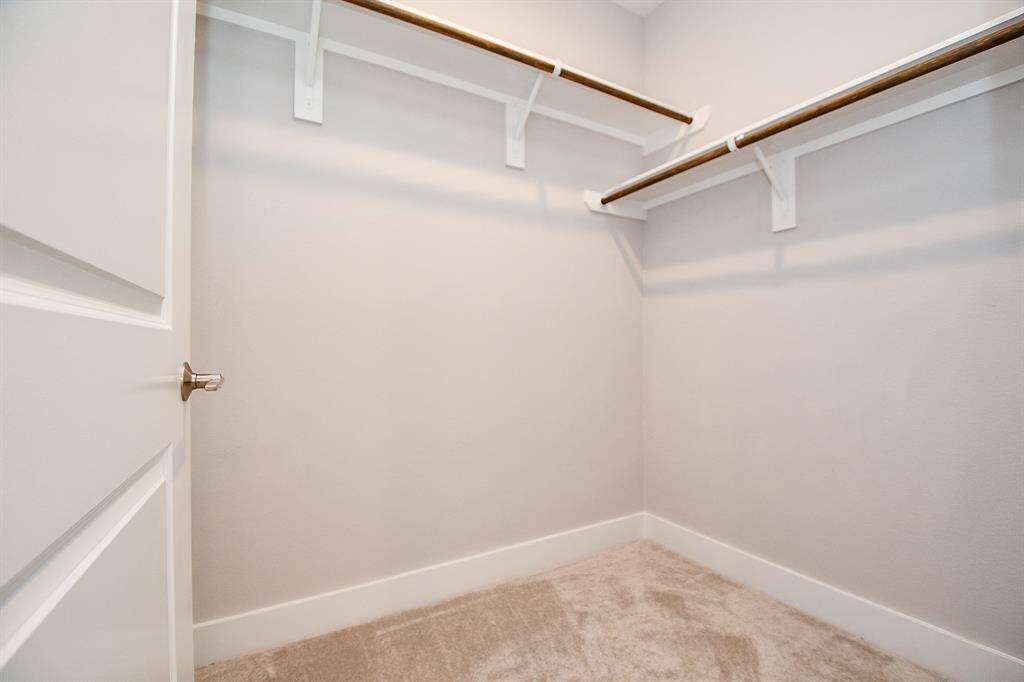 Both of the secondary bedrooms feature walk -in closets