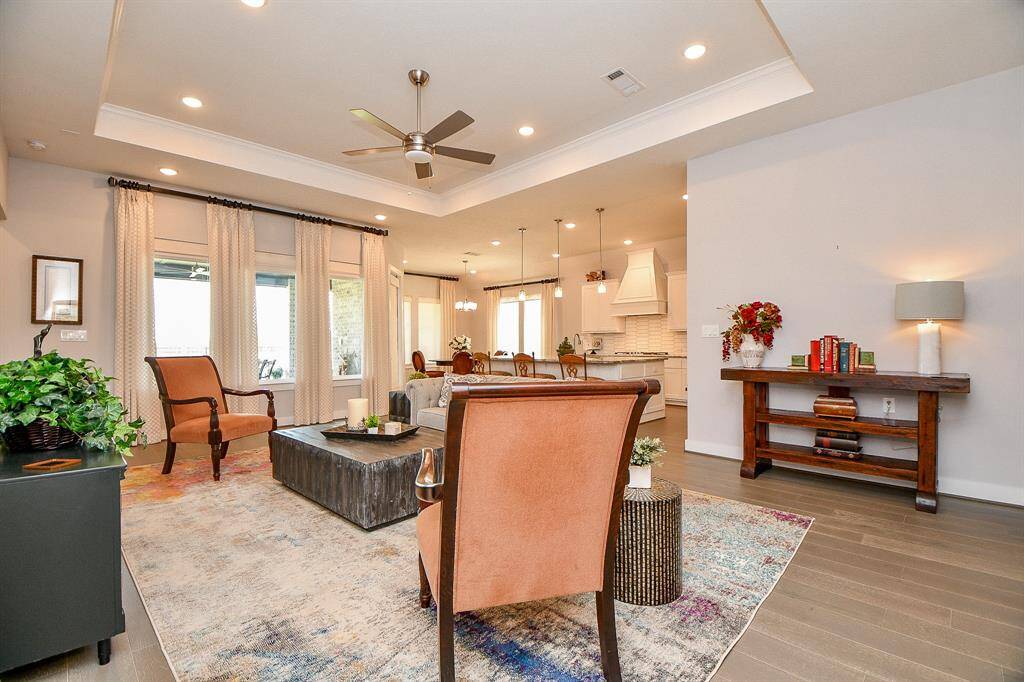 The open floorplan is enhanced with 11 foot ceilings and wood flooring.
