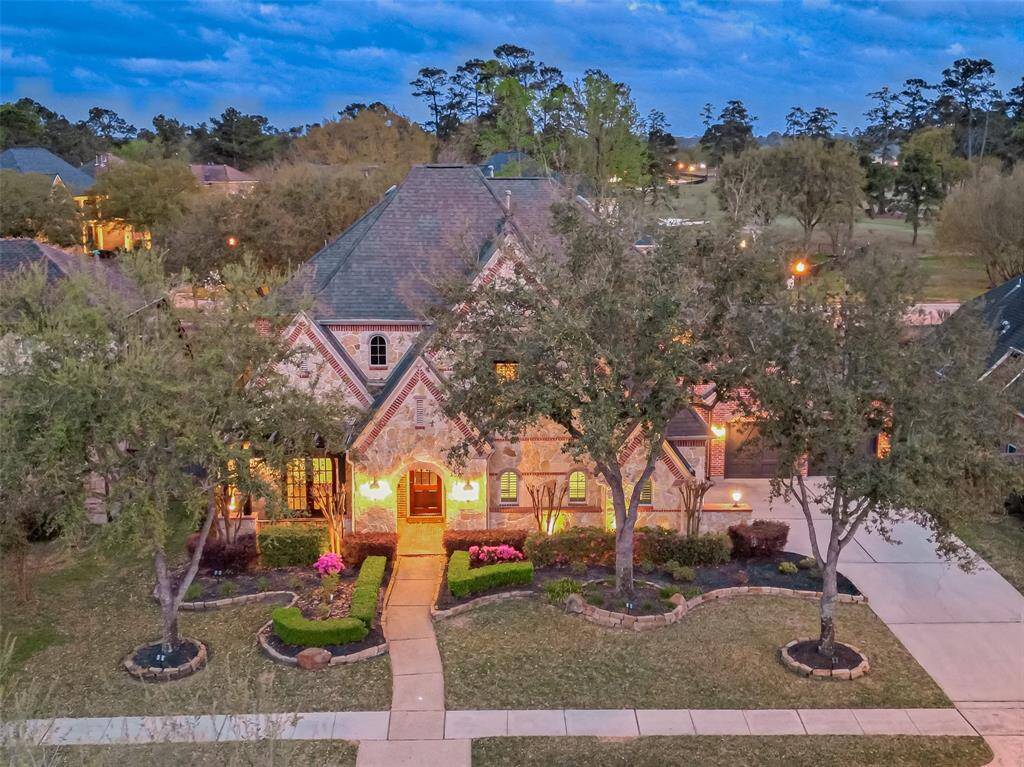 This exquisite Huntington-built home in Rose Creek offers 5 bedrooms, 4 full bathrooms, 2 half bathrooms, & a 4-car garage.