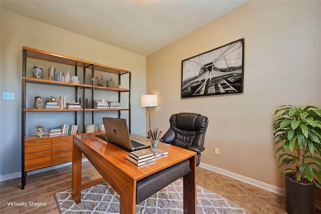 Located just off the entry, this flexible space is perfect for a refined home office or an inviting secondary living room.