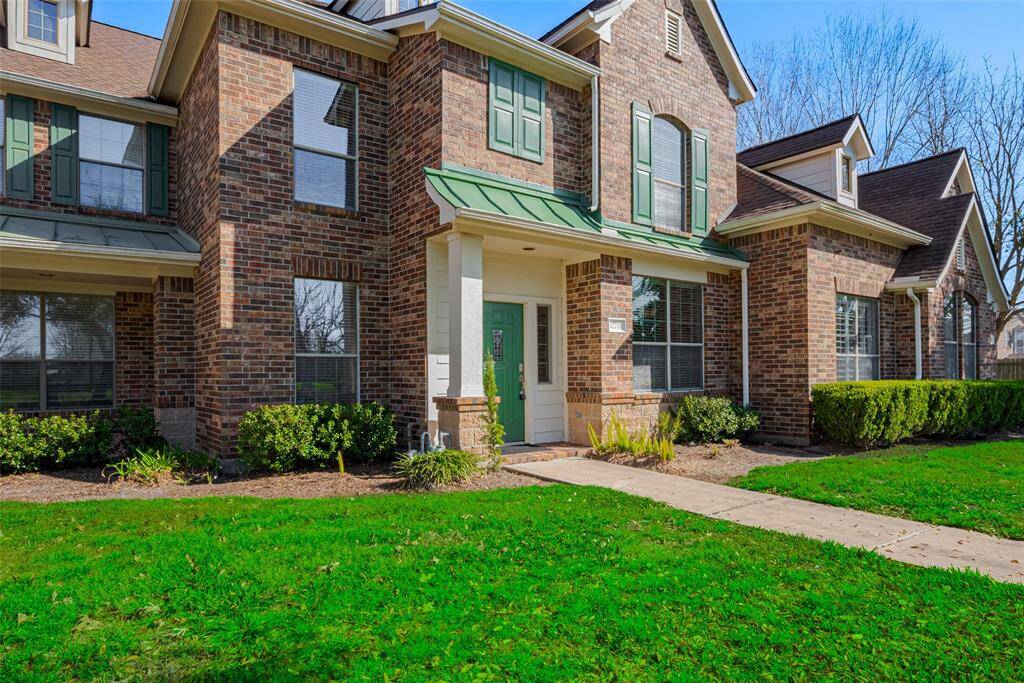 This charming two-story brick home offers timeless appeal and modern convenience. Featuring classic green shutters, a neatly landscaped yard, and a welcoming front entrance, it radiates curb appeal. A paved walkway leads to the front door, while large windows throughout fill the home with natural light, creating a bright and inviting atmosphere.