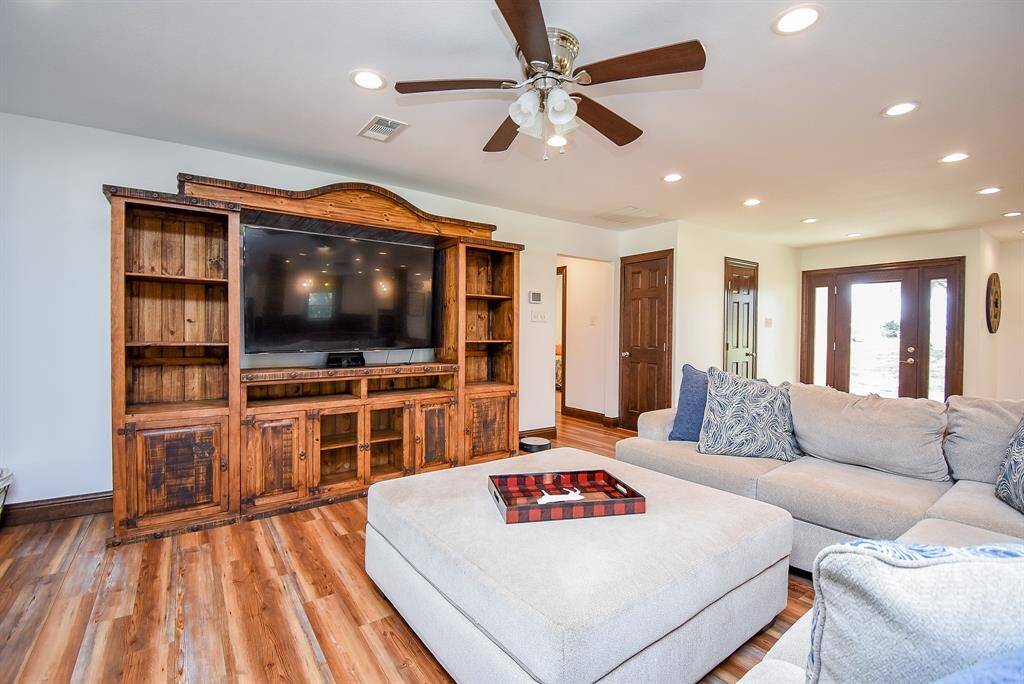 Here’s a view looking down the hallway that leads to the bedrooms. Notice the two closets here, providing plenty of storage space. This home offers abundant storage throughout, ensuring everything has its place.