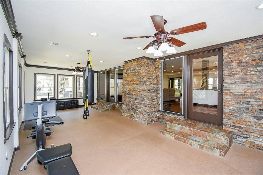 Take a look into this incredible sunroom. It’s the perfect space for a workout room, home office, or a second living area/game room. The beautiful windows throughout fill the space with an abundance of natural light, making it bright and inviting.