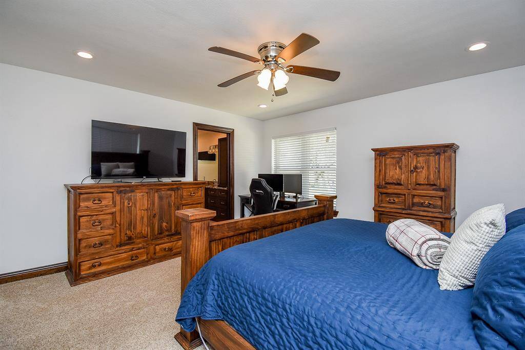 Here’s another view of this welcoming retreat, with a glimpse towards the primary bathroom.