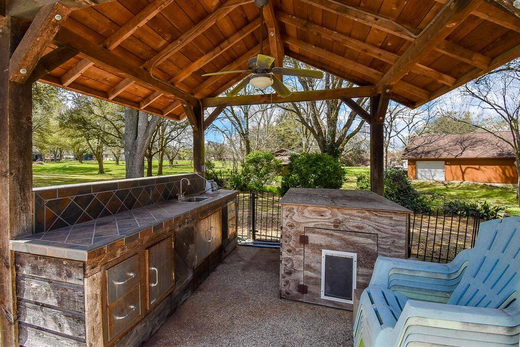 Here’s a view of the outdoor kitchen. It has rarely been used, and with a little TLC, it has the potential to become an incredible feature for this gathering area.