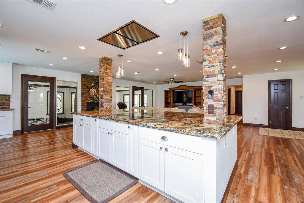This island boasts a gourmet induction stovetop and a commercial-grade vent hood, setting the stage for culinary creativity. The chef in you will be truly inspired in this kitchen!