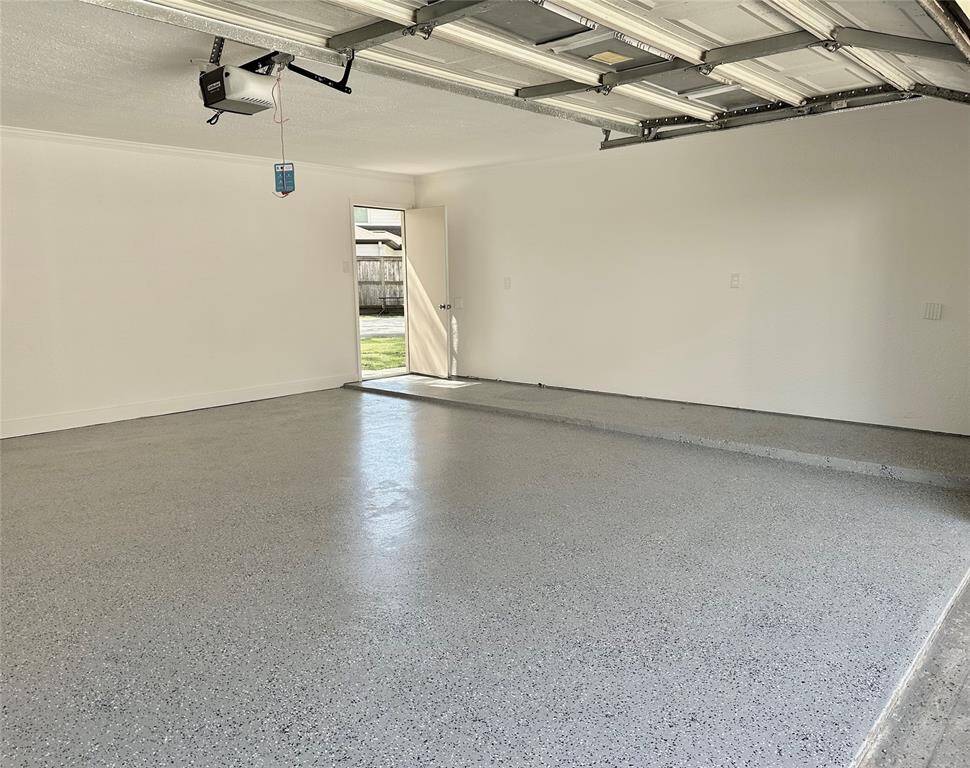 Attached / Detached 2 Car Garage has all New Interior Paint & Epoxy Flooring - would make a perfect Man Cave or She Shed!