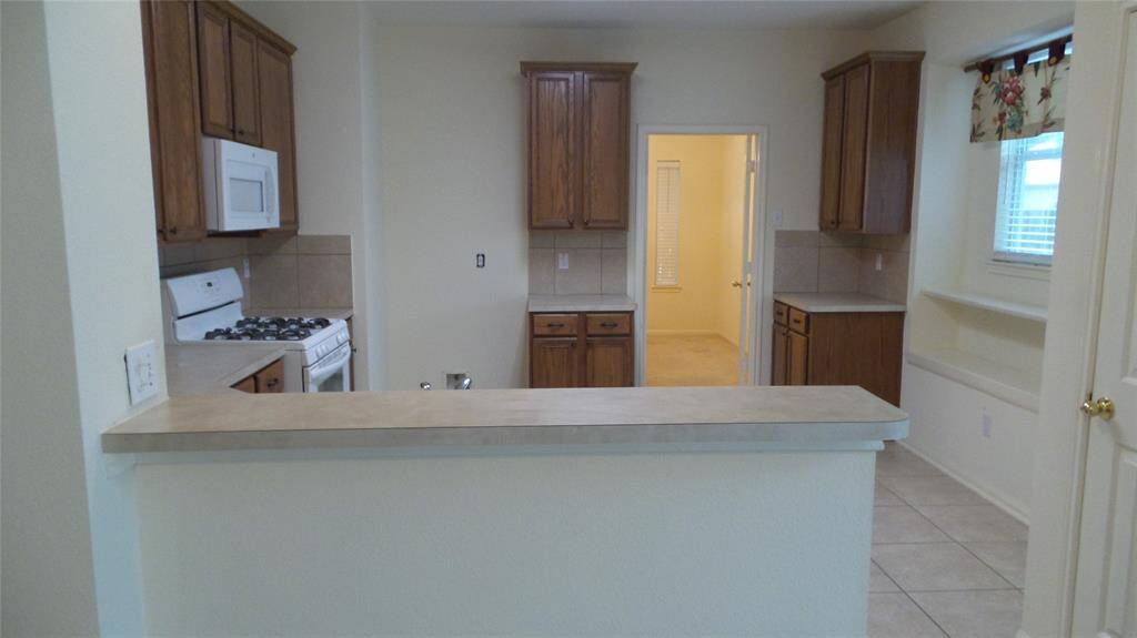 Kitchen opens to den