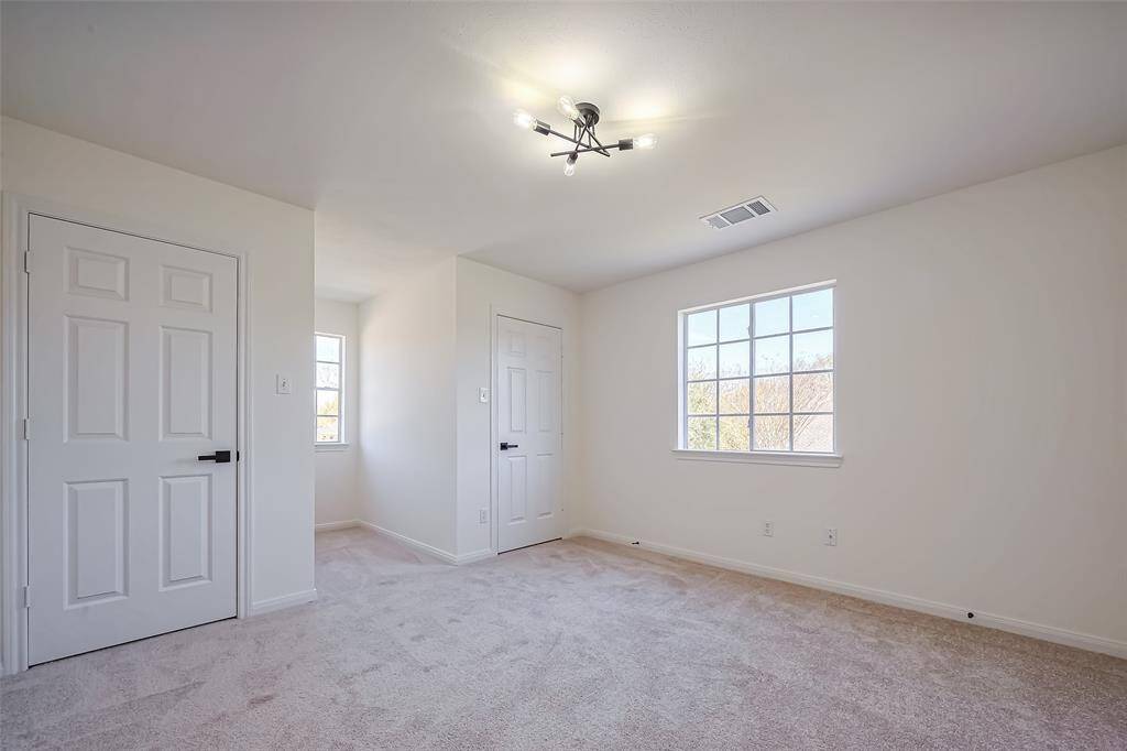One of the secondary bedrooms upstairs with new carpet.