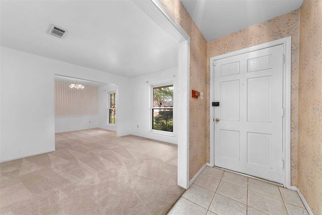 Front door leading to the formal living and dining rooms.