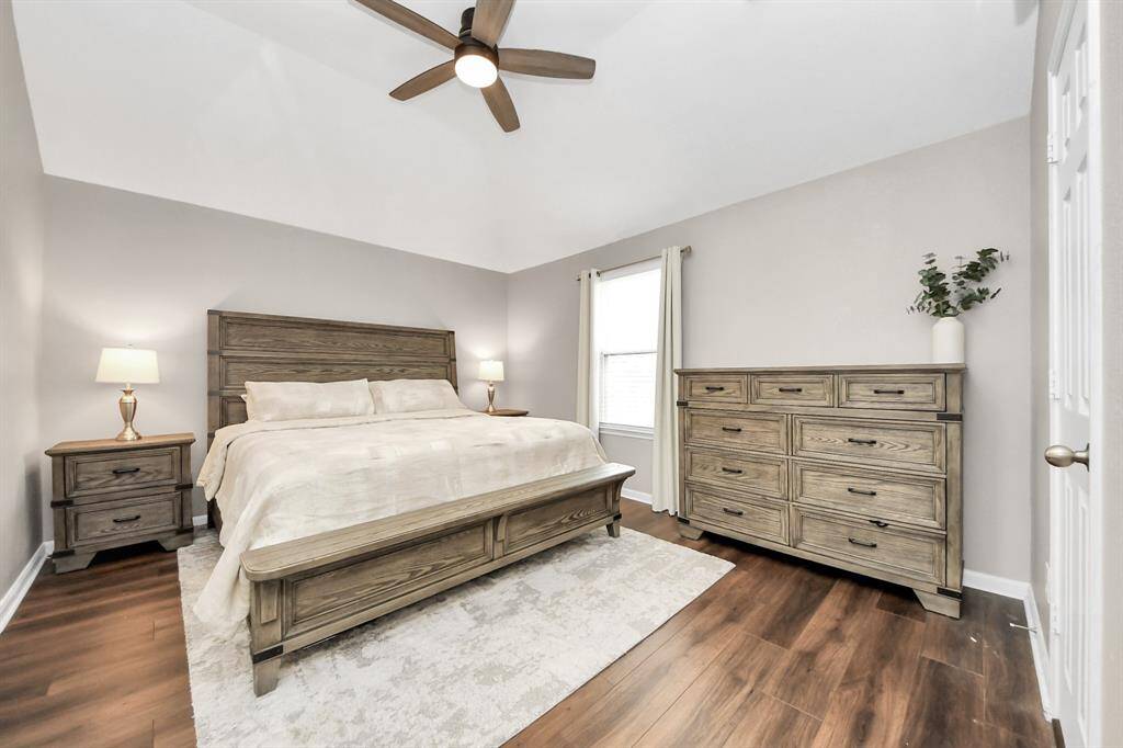 Come and unwind after a long day in this magnificent primary suite! This spacious room features LVP flooring, warm paint, high ceilings and large windows with privacy blinds.