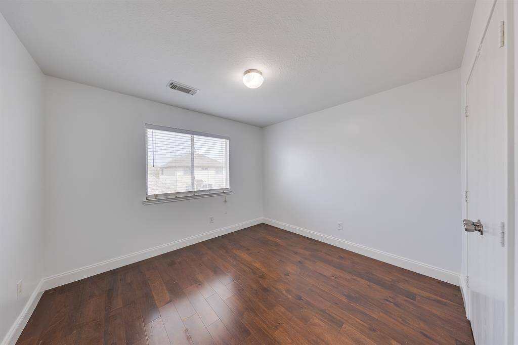 Bedroom one offers a peaceful retreat, perfect for quiet moments or a restful night’s sleep.