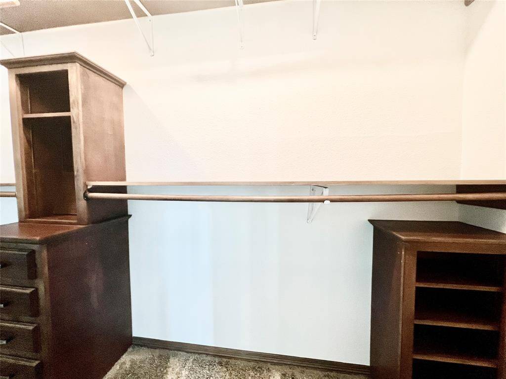 CLOSET WITH BUILT IN CABINETS.