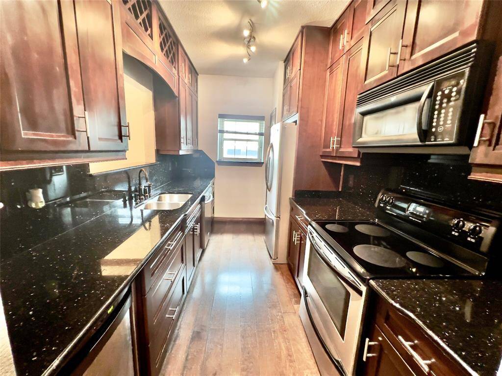 GRANITE COUNTER, CUSTOM CABIENTS WITH LOTS OF STORAGE, WINE RACK