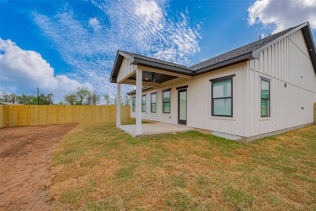 Spacious backyard with porch