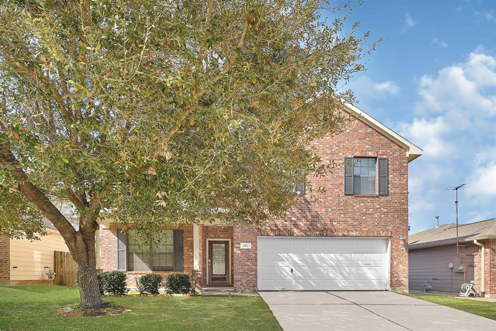 Front Home w/ shade tree.