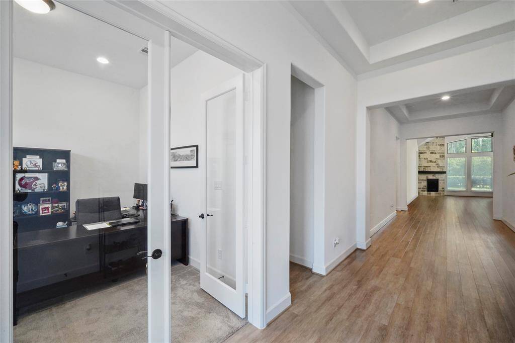 As you enter to the left is the home office, or study. Notice the 8 foot doors.