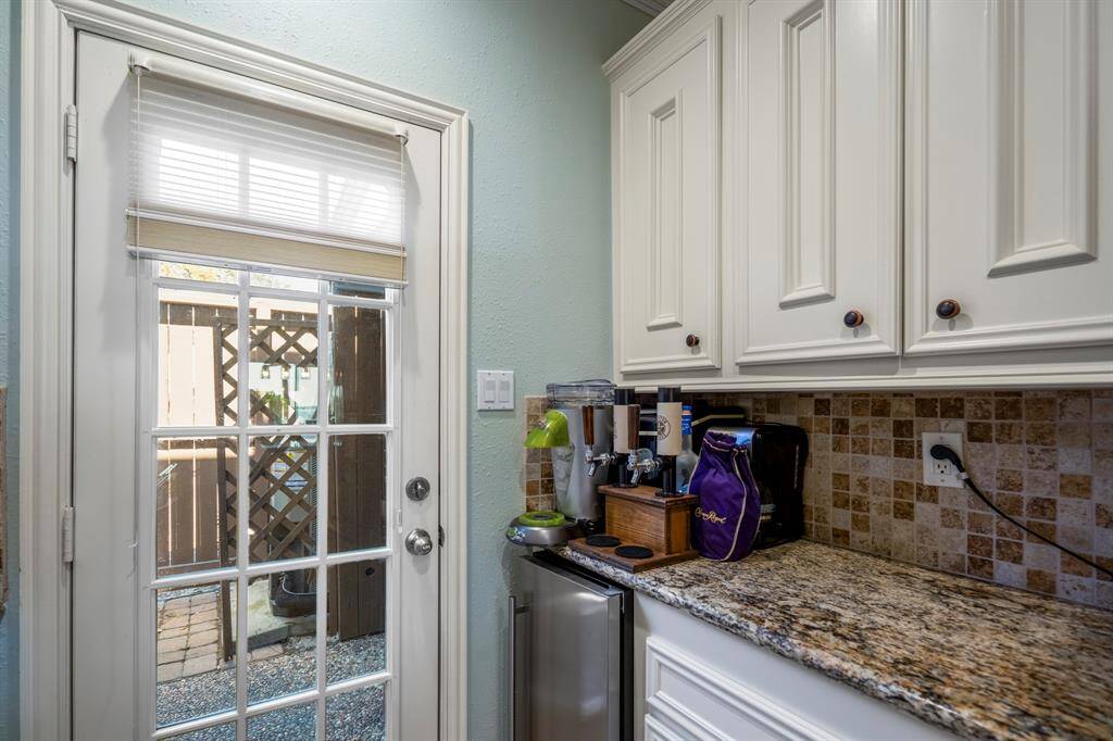 Beverage station / coffee bar with a door out to the patio.