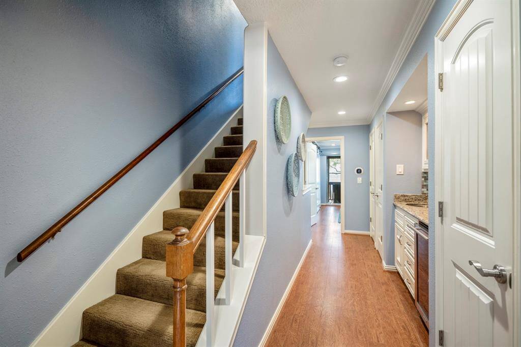 Going up the stairs to the third floor of the home.