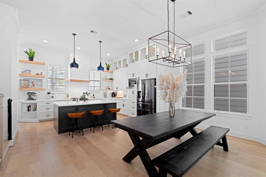 Another view of the dining area opening up to the kitchen.